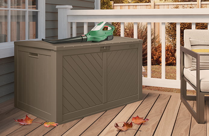 Deck box with leaf blower on top