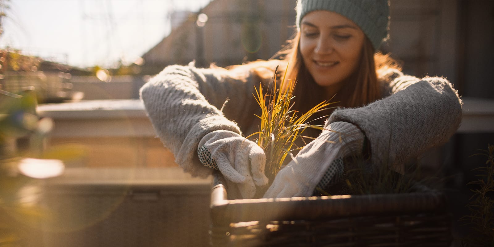 Woman planting plant into planter